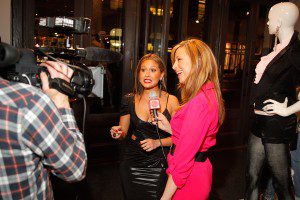 Red Carpet Roxy (in bebe-Kardashian) interviewing Adrienne Bailon photo: Runway Resource