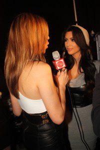 Red Carpet Roxy interviewing Kim Kardashian backstage before the bebe-Kardashian show at STYLE360 photo: Runway Resource